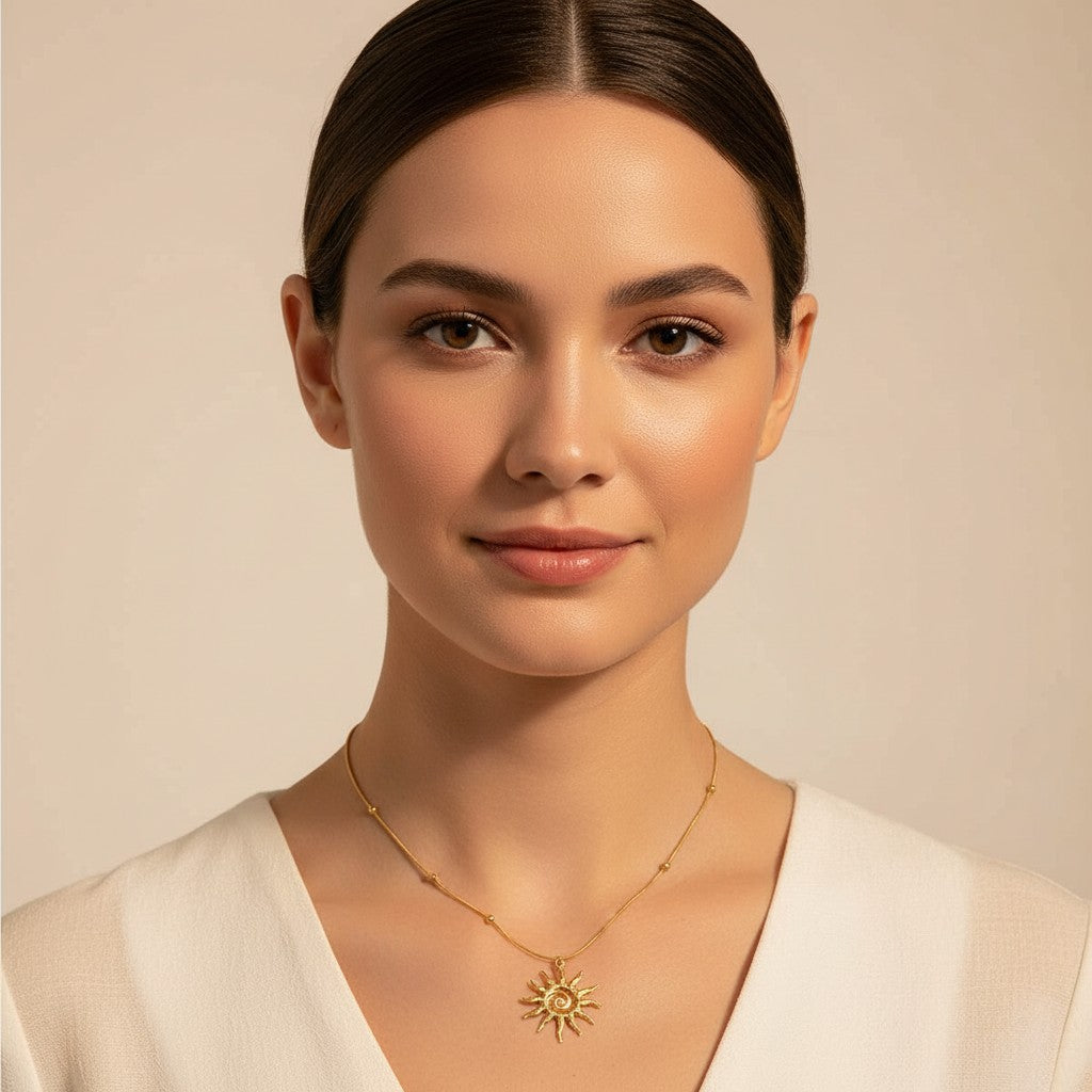 Seraphina Treasures Liora gold sun pendant necklace with beaded chain. Delicate and radiant design.