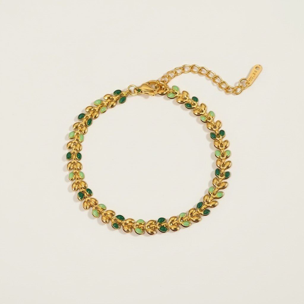 Seraphina Treasures Livia gold bracelet with green olive leaf design and adjustable clasp.