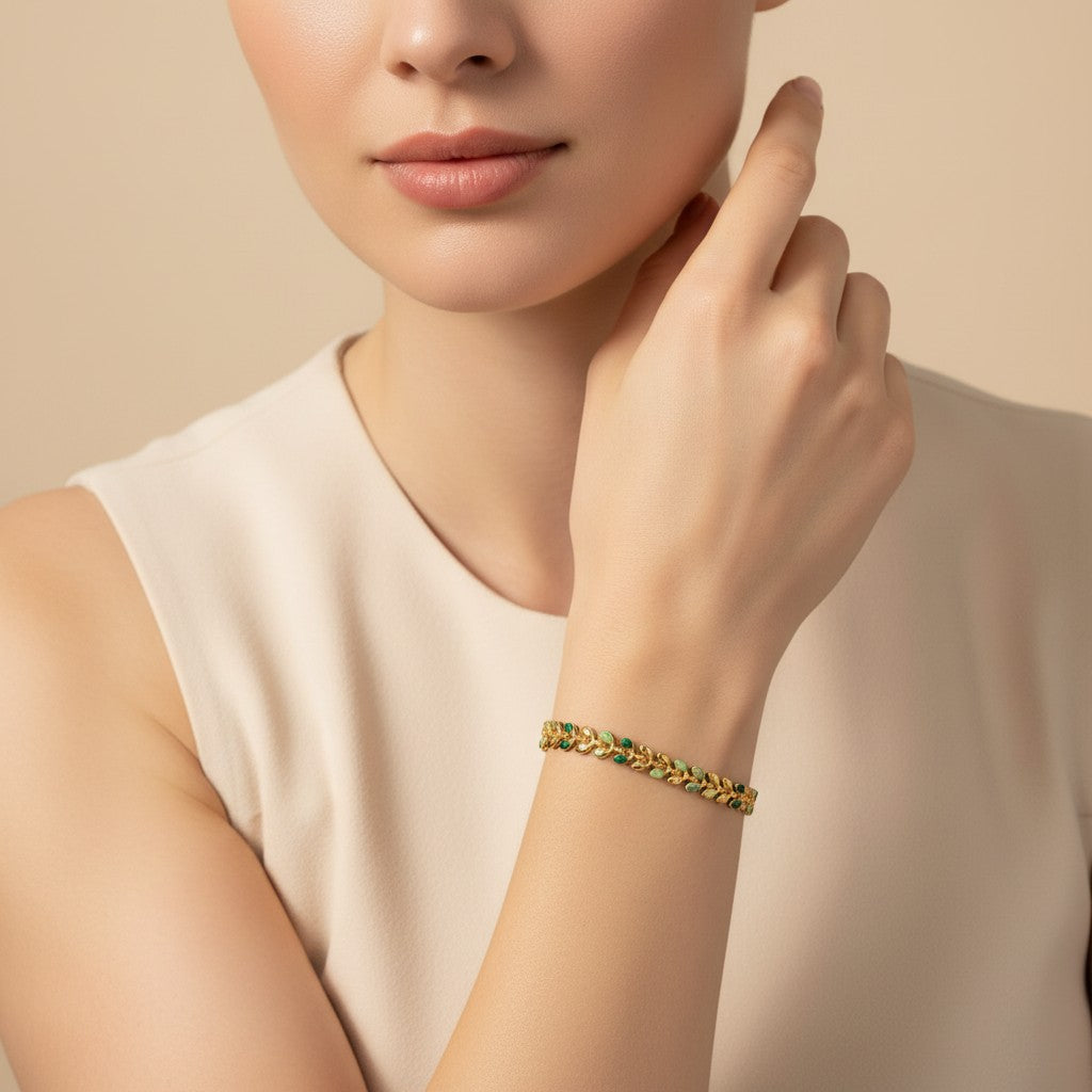 Seraphina Treasures Livia bracelet with gold chain and green olive leaf design. Adjustable clasp.