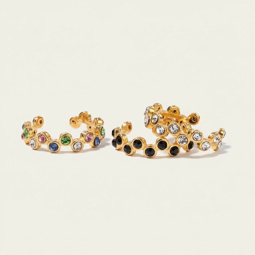 Seraphina Treasures gold-tone open ring with colorful and black sparkling stones, adjustable design.