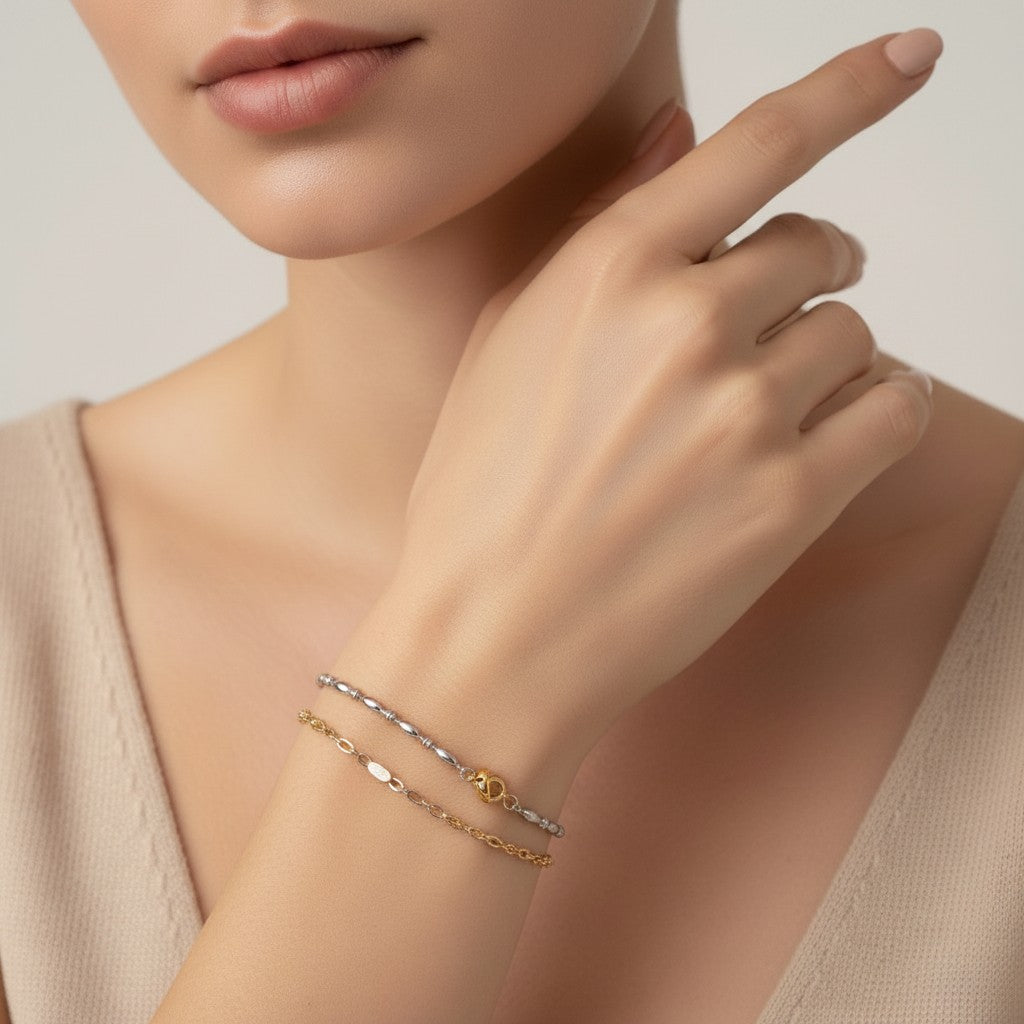 Seraphina Treasures Lumina bracelet with smooth oval beads and a delicate chain, in silver and gold tones.