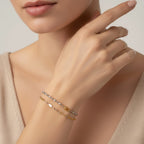 Seraphina Treasures Lumina bracelet in silver and gold, featuring smooth oval beads and a delicate chain.