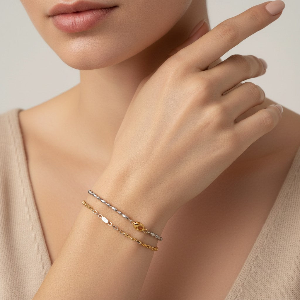 Seraphina Treasures Lumina bracelet in silver and gold, featuring smooth oval beads and a delicate chain.