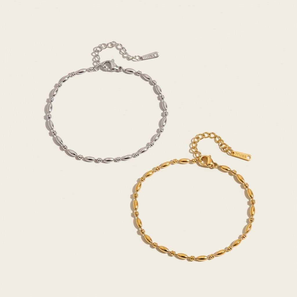 Seraphina Treasures Lumina bracelet in silver and gold, featuring delicate oval beads on a fine chain with adjustable clasp.