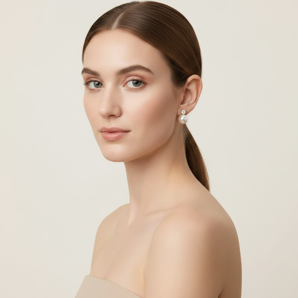 Seraphina Treasures Luminara pearl and diamond drop earrings. Classic gold-tone studs with large white pearls.