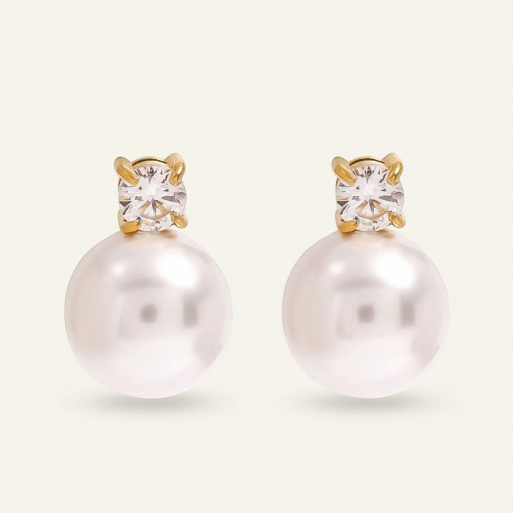 Seraphina Treasures Luminara pearl and diamond stud earrings. Classic gold-tone studs with lustrous white pearls.