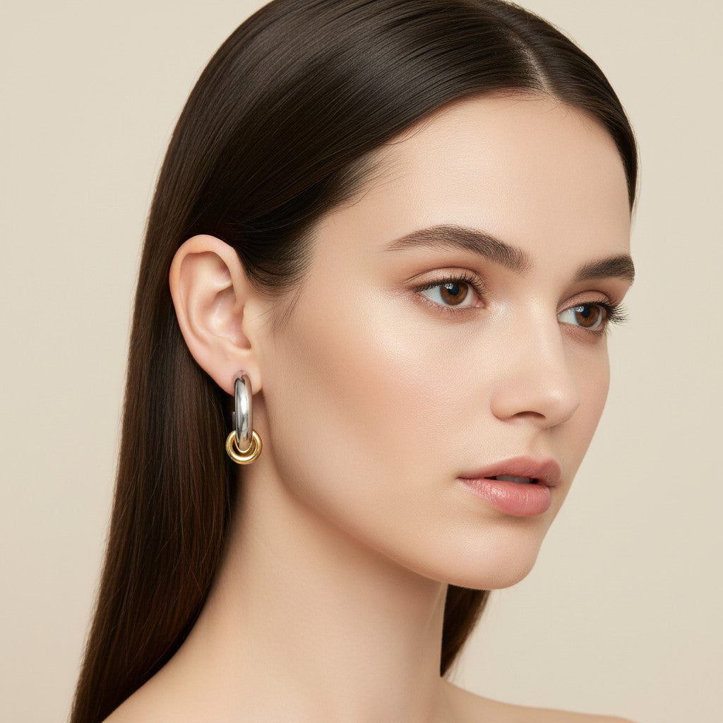 Seraphina Treasures Lunessa two-tone stainless steel hoop earrings with gold dangle accent. Waterproof, hypoallergenic.