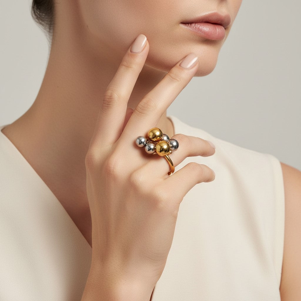 Seraphina Treasures Luxadore ring with gold hoop and dangling silver and gold beads.
