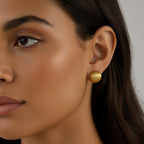 Seraphina Treasures Lyraea Earrings: gold-tone metal stud earrings with a ribbed, textured finish.