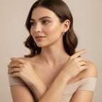 Seraphina Treasures Lyrica gold ring with irregular open design and ripple texture on a model's finger.