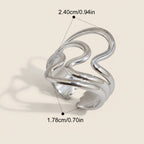 Seraphina Treasures Lyrica silver ring with irregular open design and glossy ripple texture.