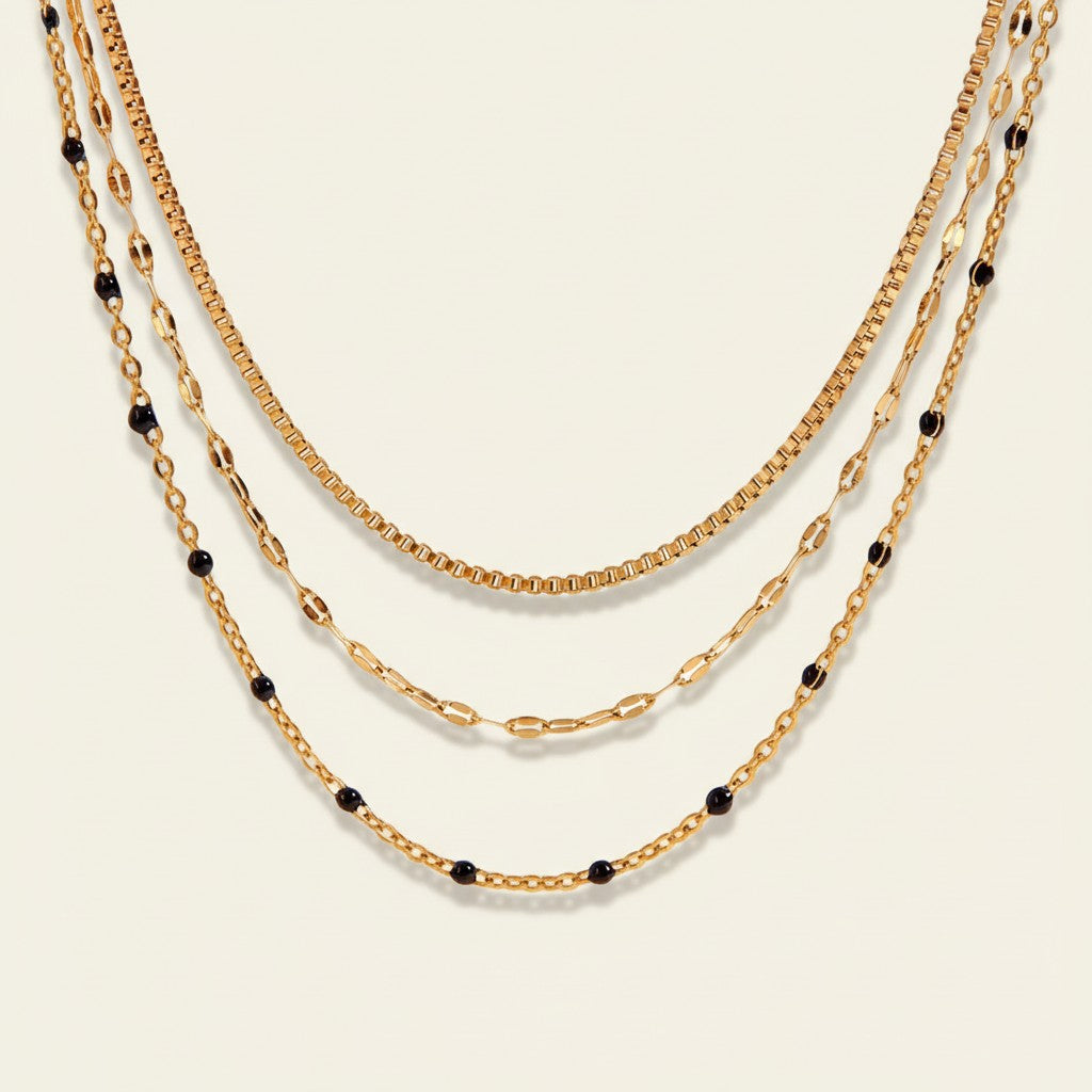 Seraphina Treasures Magnolia layered gold necklace with black beads. Elegant, modern design.