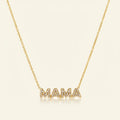Seraphina Treasures gold necklace with 'MAMA' pendant encrusted with clear crystals.