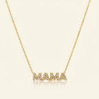 Seraphina Treasures gold necklace with 'MAMA' pendant encrusted with clear crystals.