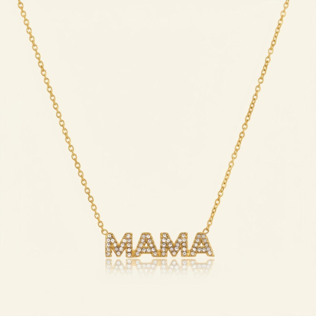 Seraphina Treasures gold necklace with 'MAMA' pendant encrusted with clear crystals.