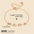 Seraphina Treasures gold-tone bracelet with "MAMA" spelled out in rhinestone-embellished letters.