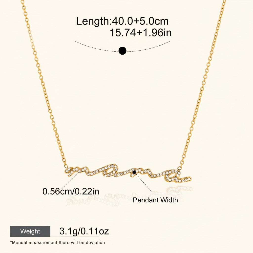 Seraphina Treasures gold-tone necklace with "Maméra" script pendant encrusted with clear crystals. Adjustable chain.