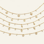 Seraphina Treasures Marcellina gold necklaces with crystal star, lightning bolt, cross, and heart charms.