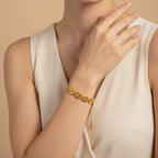 Seraphina Treasures Medea gold tone bracelet with open shell charms and adjustable chain.