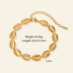 Seraphina Treasures Medea gold tone bracelet with shell charms and adjustable clasp. Lightweight and elegant for everyday or special occasions.