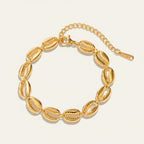 Seraphina Treasures Medea gold tone bracelet with shell charms and adjustable clasp.