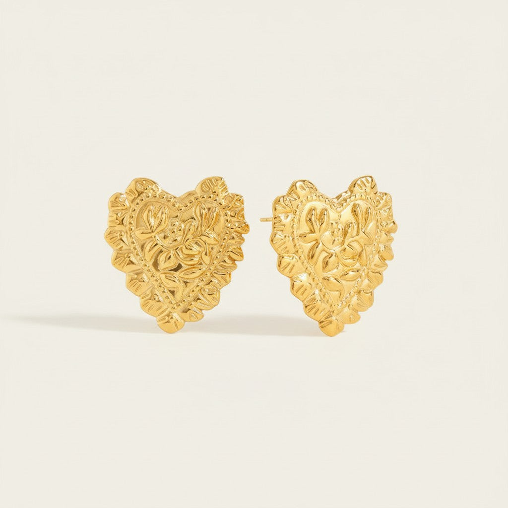 Seraphina Treasures Melistra gold heart earrings with intricate floral design. Bold stud earrings for special occasions.