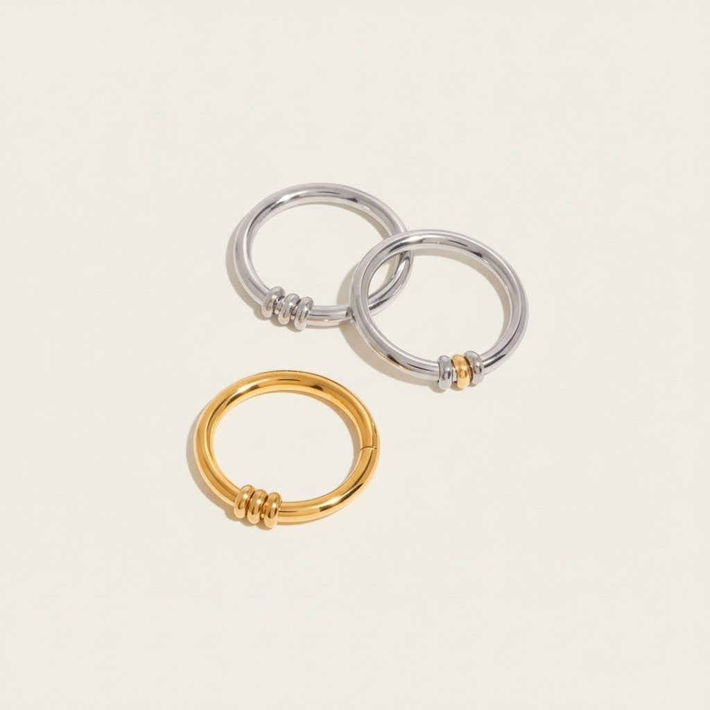 Seraphina Treasures Miravore hoop earrings in silver and gold, featuring stacked bead details.