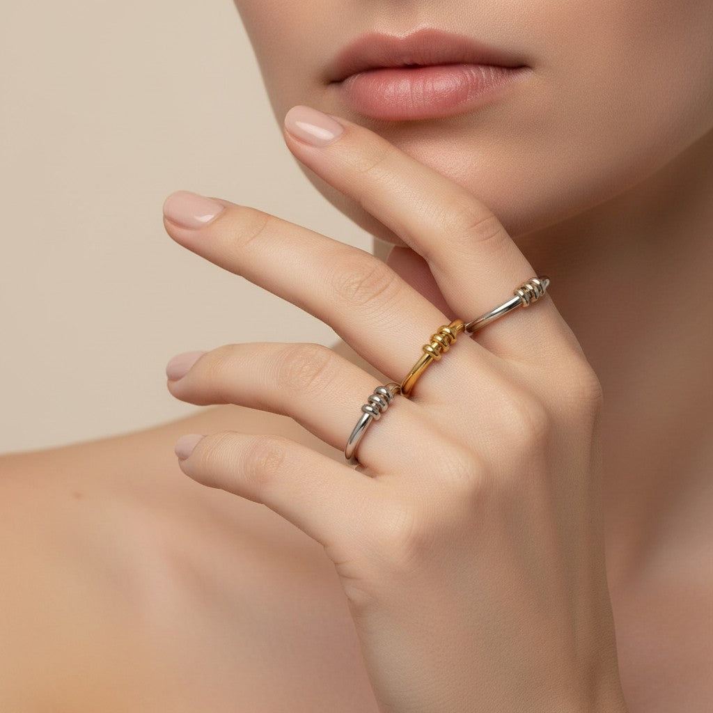 Seraphina Treasures Miravore rings in silver and gold, featuring a delicate band with small pendant details.