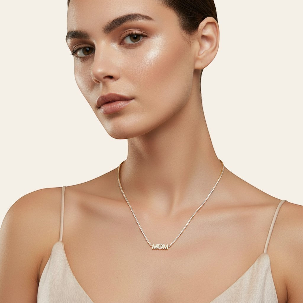 Seraphina Treasures gold necklace with crystal-lined chain and "MOM" pendant, perfect for Mother's Day.