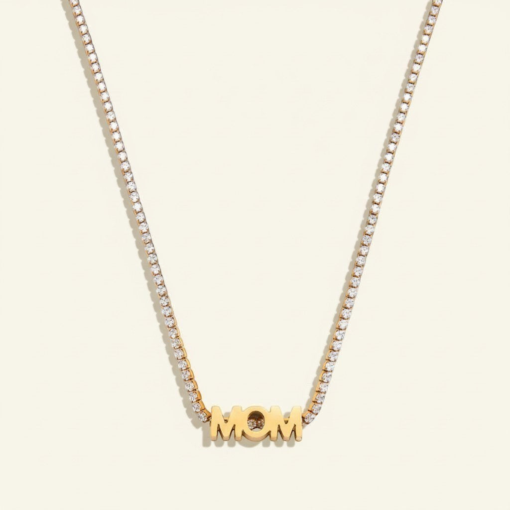 Seraphina Treasures gold necklace with crystal-lined chain and bold "MOM" pendant, perfect for Mother's Day.