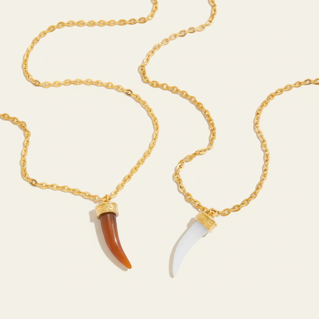 Seraphina Treasures Myrrhena necklace with brown and white horn-shaped resin pendants on gold chains.