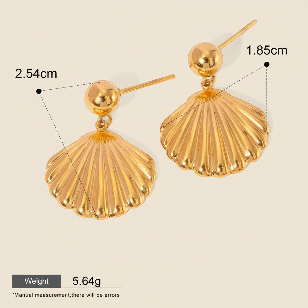Seraphina Treasures Nerivelle gold shell dangle earrings. Lightweight, hypoallergenic, and waterproof.