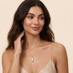 Seraphina Treasures Nerys necklace with a lustrous, asymmetrical baroque pearl pendant on a gold chain.