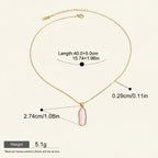 Seraphina Treasures Nerys necklace with a gold chain and a single, irregular white pearl pendant. Features adjustable length.