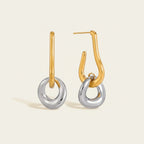 Seraphina Treasures Nikareon two-tone gold and silver geometric drop earrings with angular shapes.