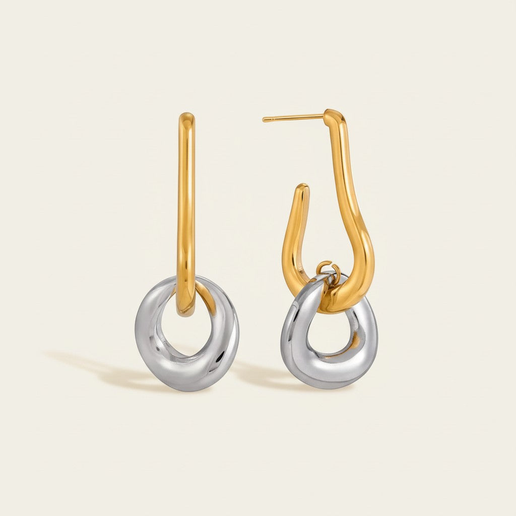 Seraphina Treasures Nikareon two-tone gold and silver geometric drop earrings with angular shapes.