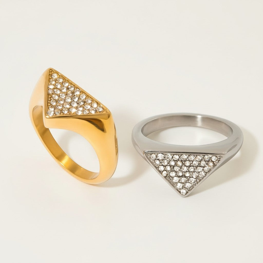 Seraphina Treasures Olyra ring in gold and silver, featuring a triangular face paved with clear rhinestones.