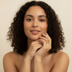 Seraphina Treasures Ondara gold ring with hollow, smooth, curved design on a model's finger.
