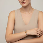 Seraphina Treasures Opaline bracelet with dual-tone metal links and a gold toggle clasp.