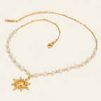 Seraphina Treasures Oria gold necklace with pearl accents and a sun pendant. Elegant chain with small white pearls.