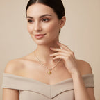 Seraphina Treasures Oria necklace with a gold sun pendant and pearls on a delicate gold chain.
