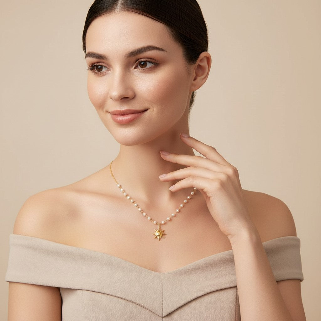 Seraphina Treasures Oria necklace with a gold sun pendant and pearls on a delicate gold chain.