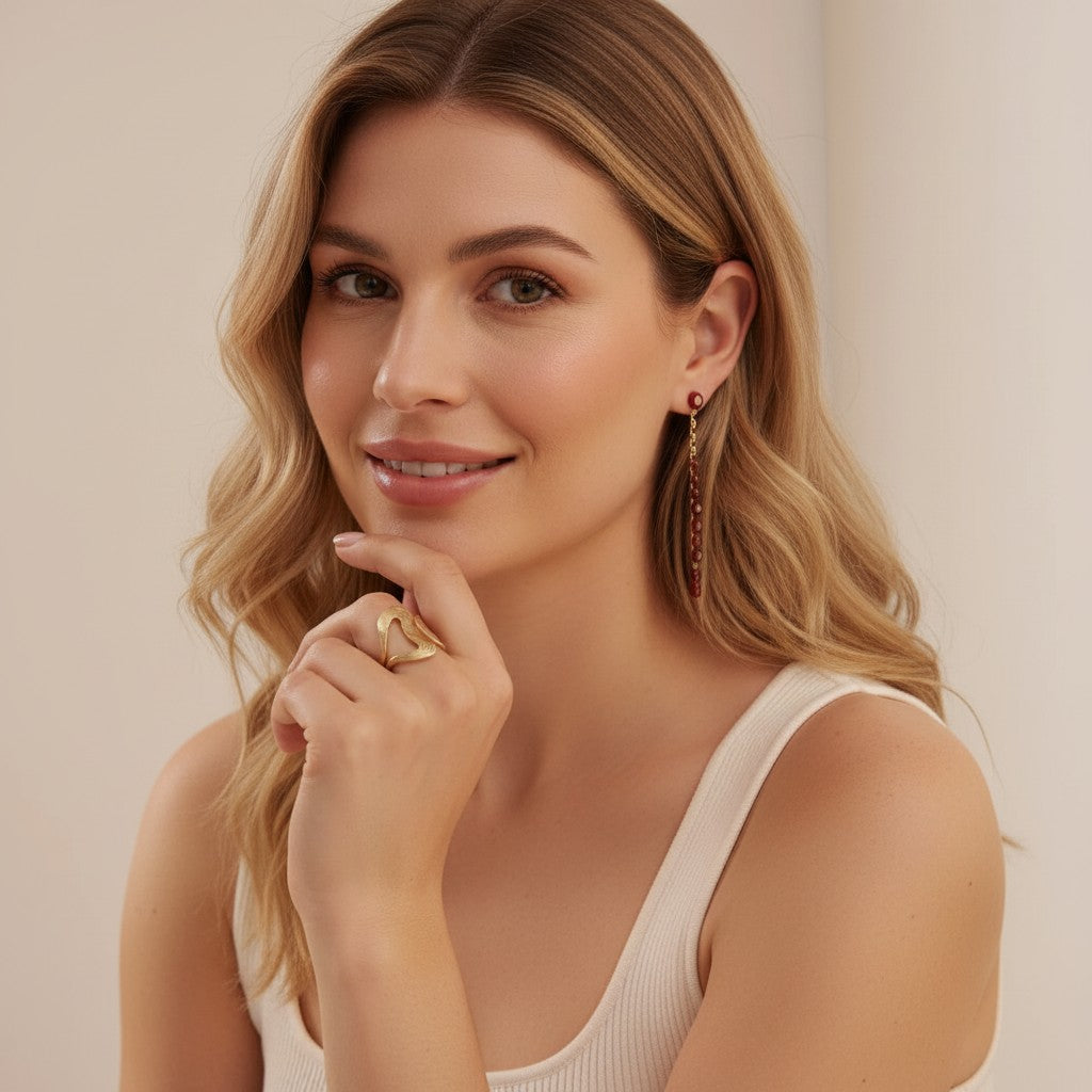 Seraphina Treasures Orichal Ring, a gold-tone abstract design with a textured finish, worn on a model's finger.