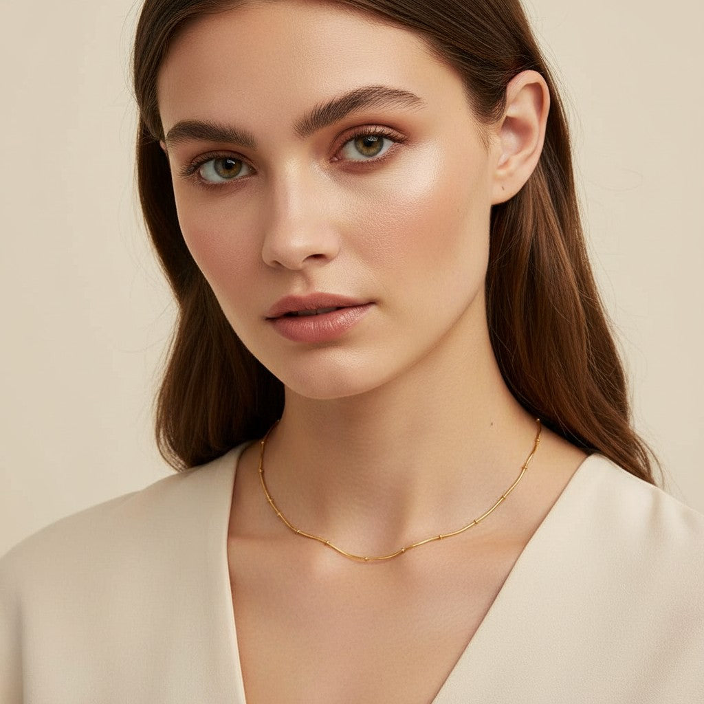 Seraphina Treasures Orielle gold-tone necklace with delicate beaded accents and a snake chain, perfect for everyday wear.