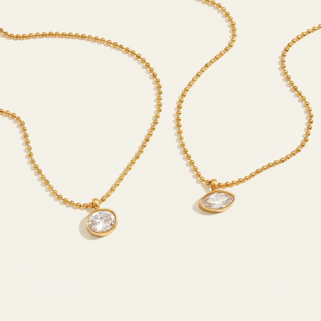 Seraphina Treasures Orpheus gold necklaces with oval and horse eye cut zircon pendants. Timeless style.