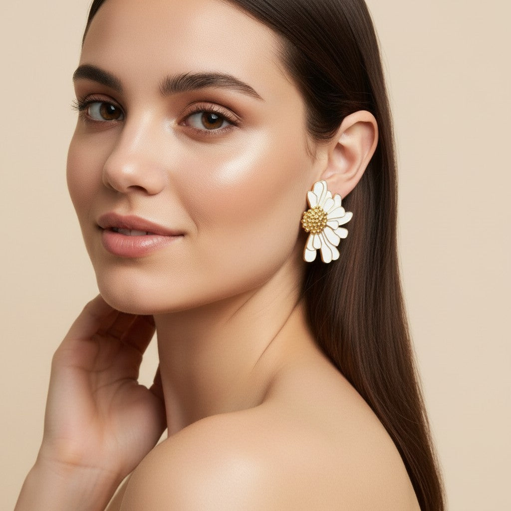 Seraphina Treasures pink enamel daisy earrings with gold accents and textured center.