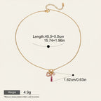 Seraphina Treasures Carys necklace with a gold chain and a pink heart-shaped zirconia pendant.