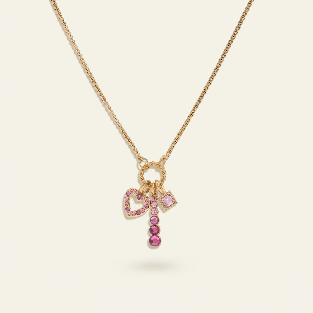 Seraphina Treasures gold necklace with pink heart charm and pink cubic zirconia.