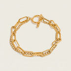Seraphina Treasures Rhea gold layered chain bracelet with toggle clasp and oval links.