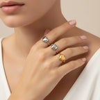 Seraphina Treasures Sapphira ring with a heart design in silver and gold tones. Stainless steel.
